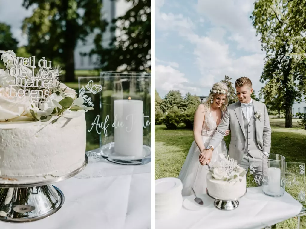 Anschnitt der Hochzeitstorte im Garten des Schlossgut Groß Schwansee